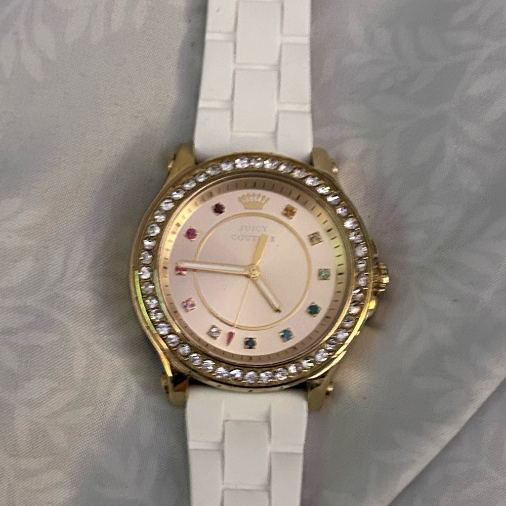Juicy Couture white band with diamond bezel.